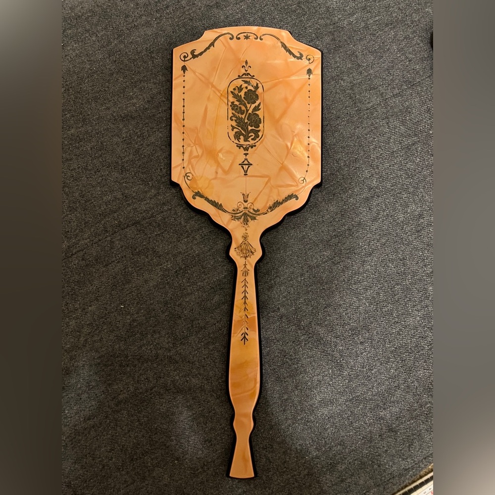 Vintage Art Deco style handheld vanity mirror with a touch of whimsy